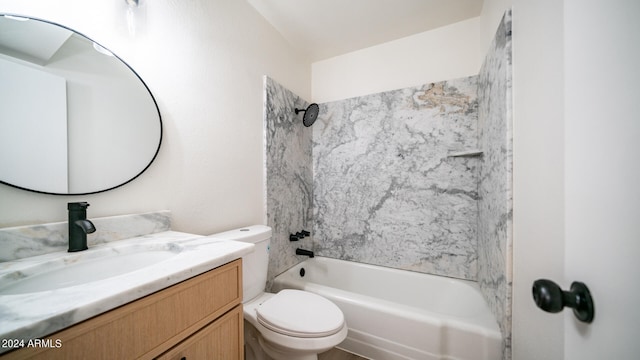 full bathroom with vanity, tiled shower / bath, and toilet