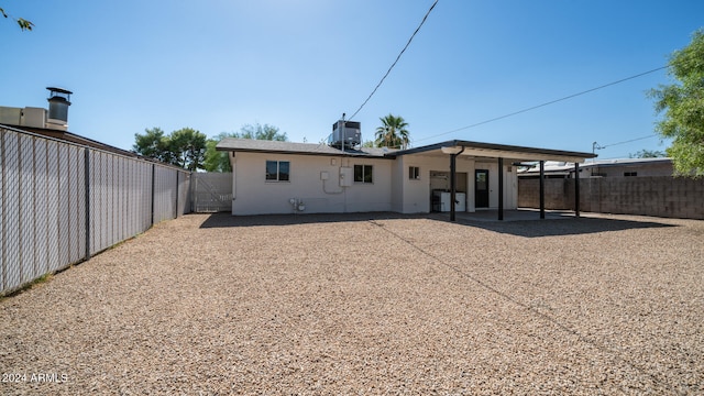 rear view of house with a patio and central air condition unit