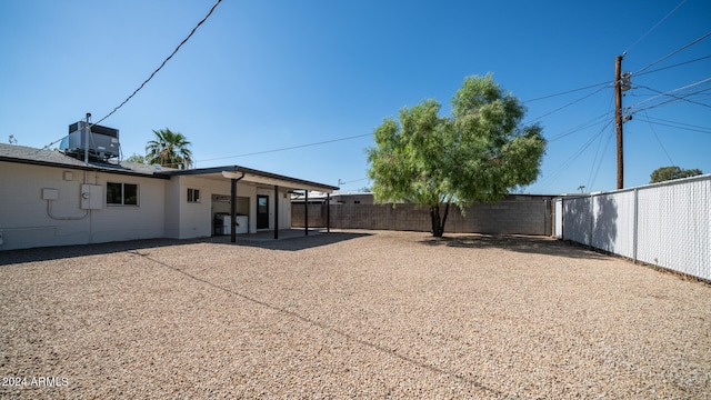 view of yard featuring a patio and central AC unit