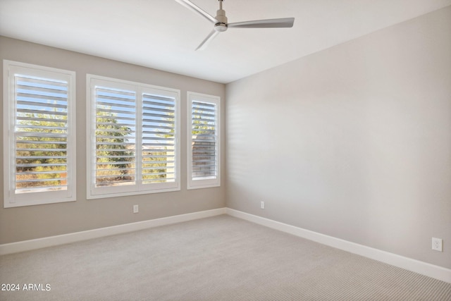 spare room with ceiling fan and carpet flooring