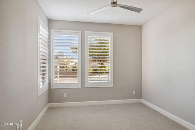 carpeted empty room with ceiling fan