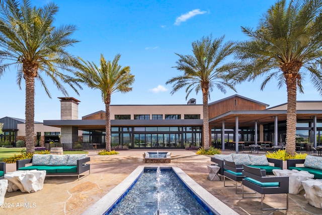 view of pool featuring outdoor lounge area and a patio area