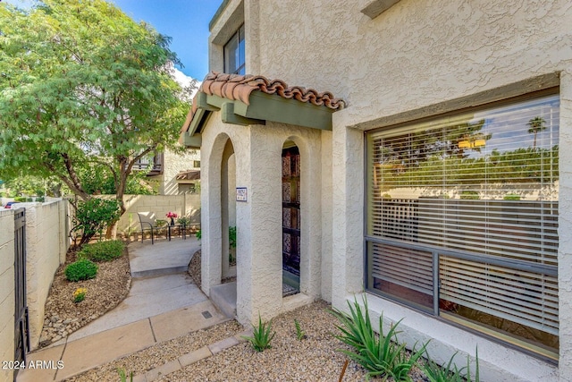 entrance to property featuring a patio area