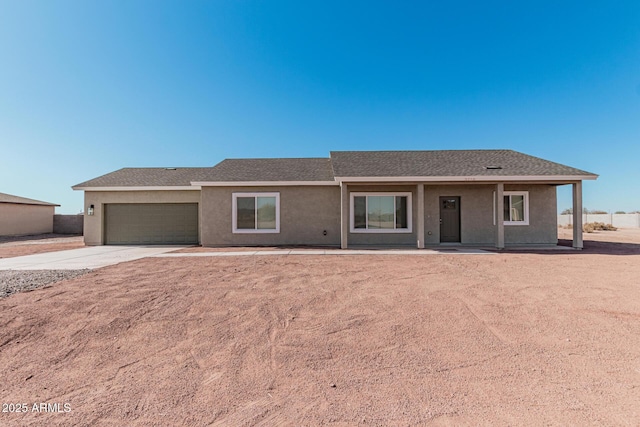 ranch-style home featuring a garage