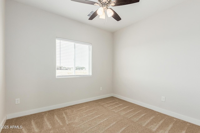 spare room with ceiling fan and carpet flooring