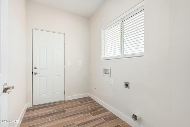 washroom featuring dark wood-type flooring, hookup for an electric dryer, and hookup for a washing machine