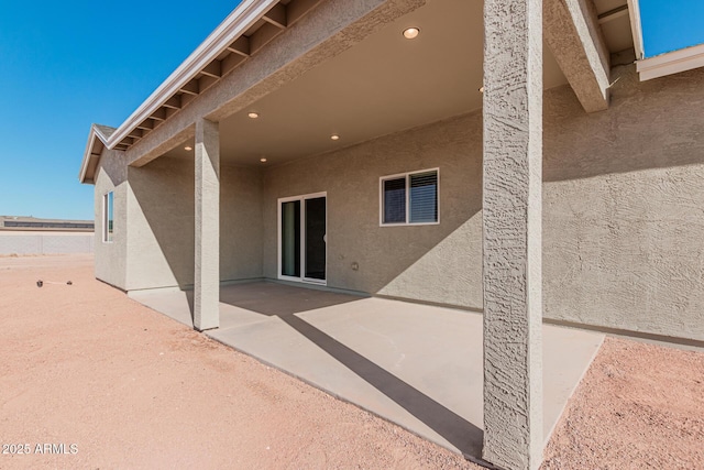 back of property featuring a patio