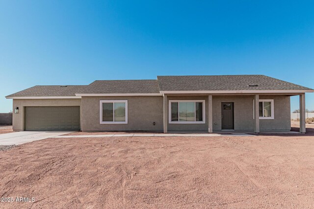 ranch-style house featuring a garage