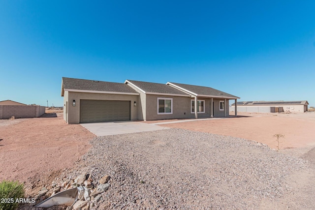 ranch-style house featuring a garage