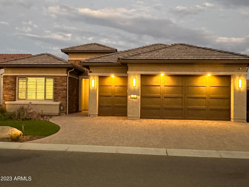 prairie-style house featuring a garage