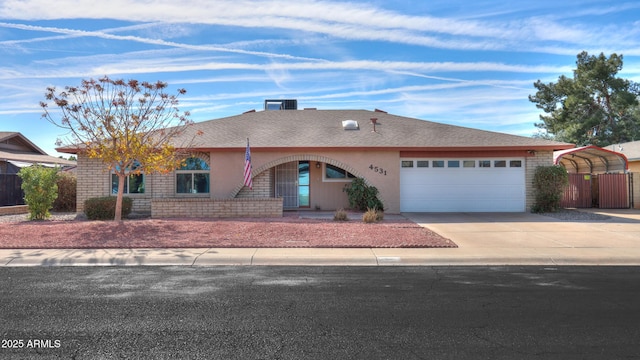 single story home with a carport and a garage