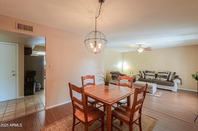 dining area featuring hardwood / wood-style floors and ceiling fan