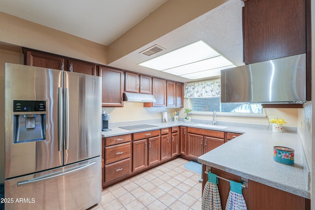 kitchen with light tile patterned flooring, sink, black electric cooktop, and stainless steel fridge with ice dispenser