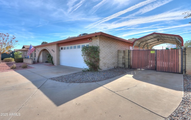 view of front of property with a garage and a carport