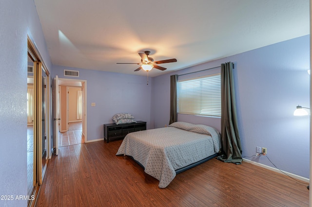 bedroom with ceiling fan and wood-type flooring