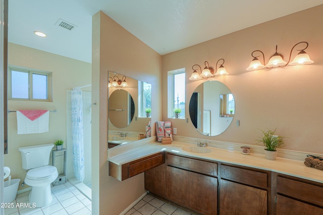 bathroom featuring tile patterned flooring, vanity, a shower with curtain, and toilet