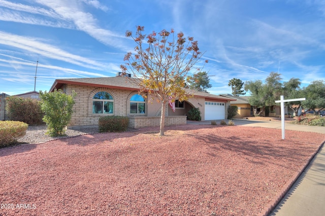 ranch-style house featuring a garage