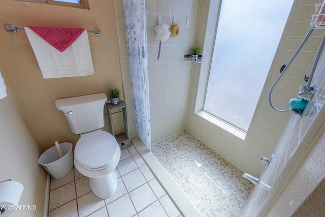 bathroom with toilet, tile patterned flooring, and a shower with shower curtain