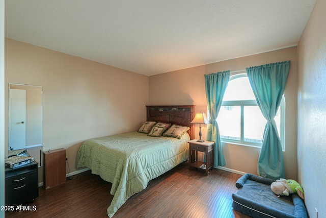 bedroom featuring dark hardwood / wood-style flooring