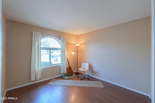 unfurnished room with hardwood / wood-style flooring