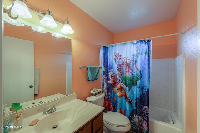 full bathroom featuring shower / bath combo, vanity, and toilet