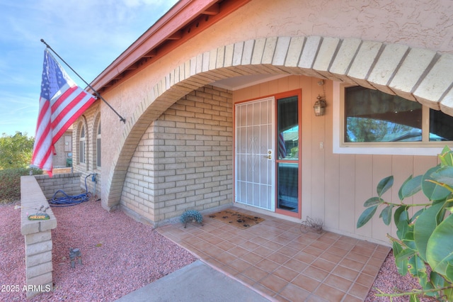 doorway to property featuring a patio