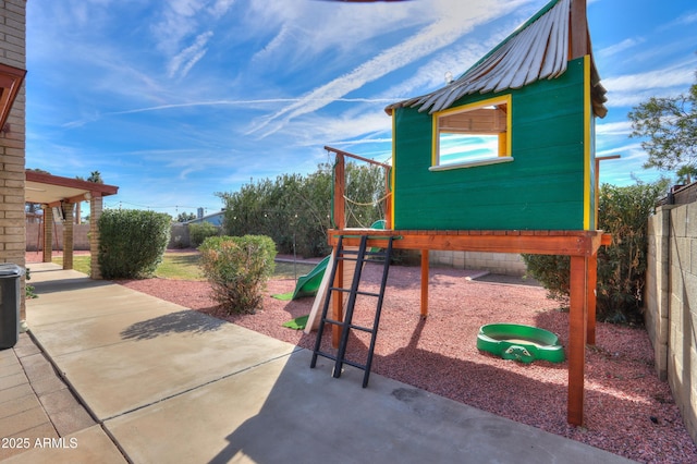 view of play area featuring a patio area