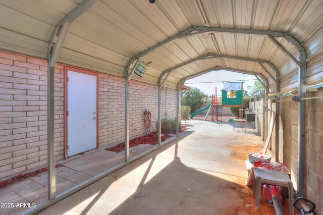 exterior space with a playground and a carport