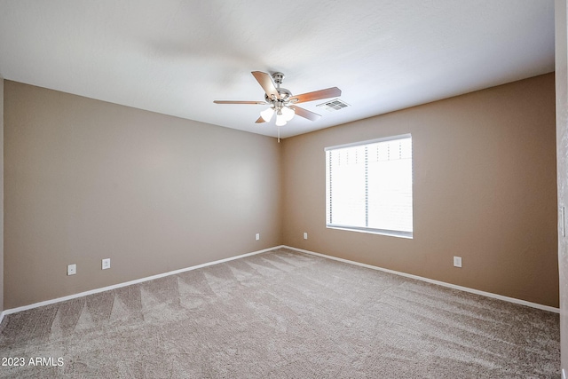 carpeted empty room with ceiling fan