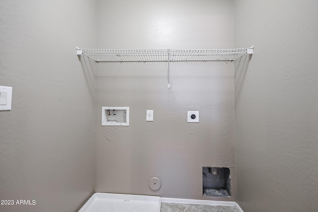 washroom featuring hookup for an electric dryer, gas dryer hookup, and washer hookup