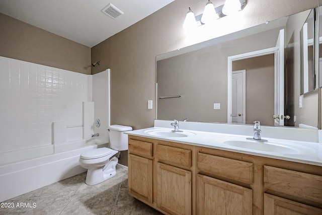 full bathroom with bathing tub / shower combination, tile patterned flooring, vanity, and toilet