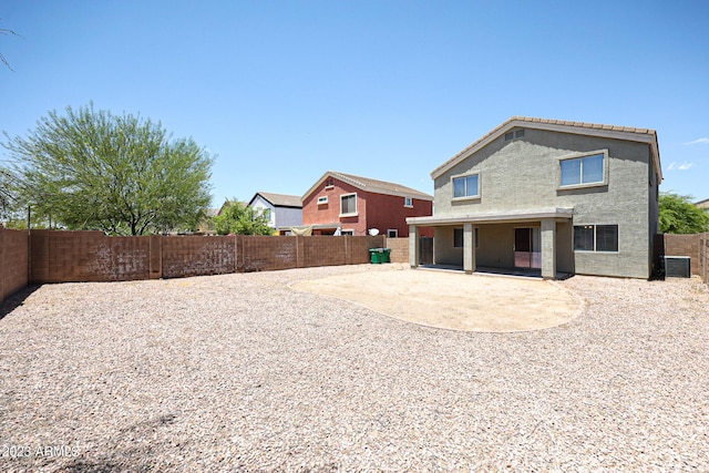 back of property featuring central AC unit and a patio