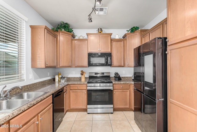 kitchen with light tile patterned flooring, visible vents, black appliances, and a sink