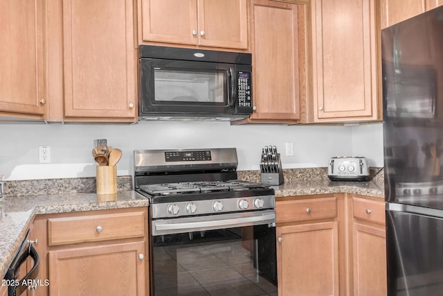 kitchen featuring stainless steel appliances and tile patterned flooring