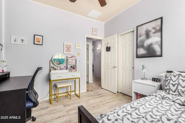 bedroom featuring wood finished floors, visible vents, and ceiling fan