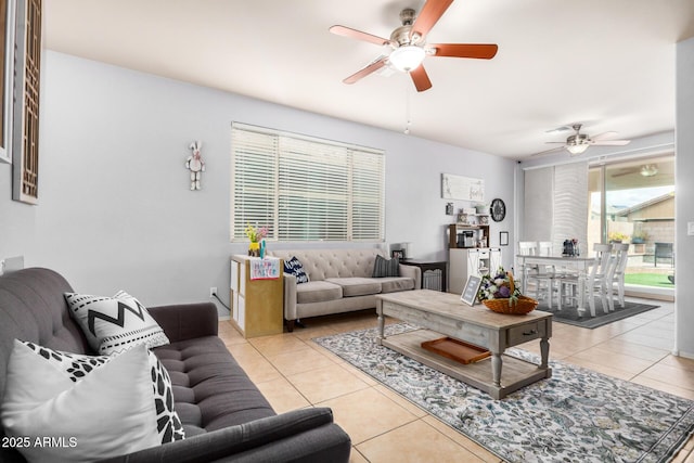 living room with light tile patterned floors and ceiling fan