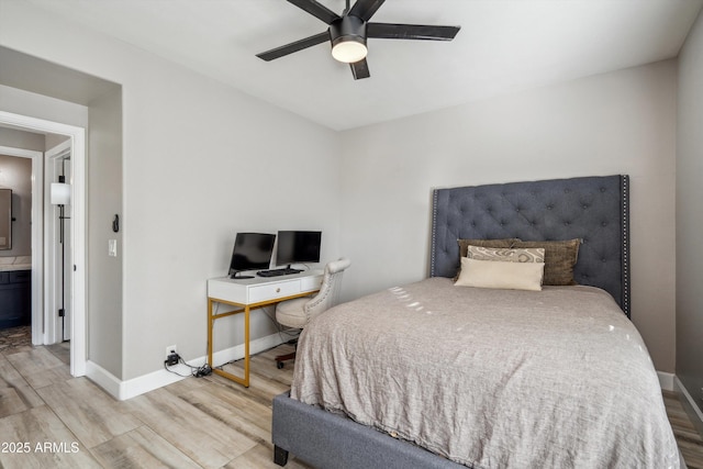 bedroom with electric panel, ceiling fan, light wood-style flooring, and baseboards