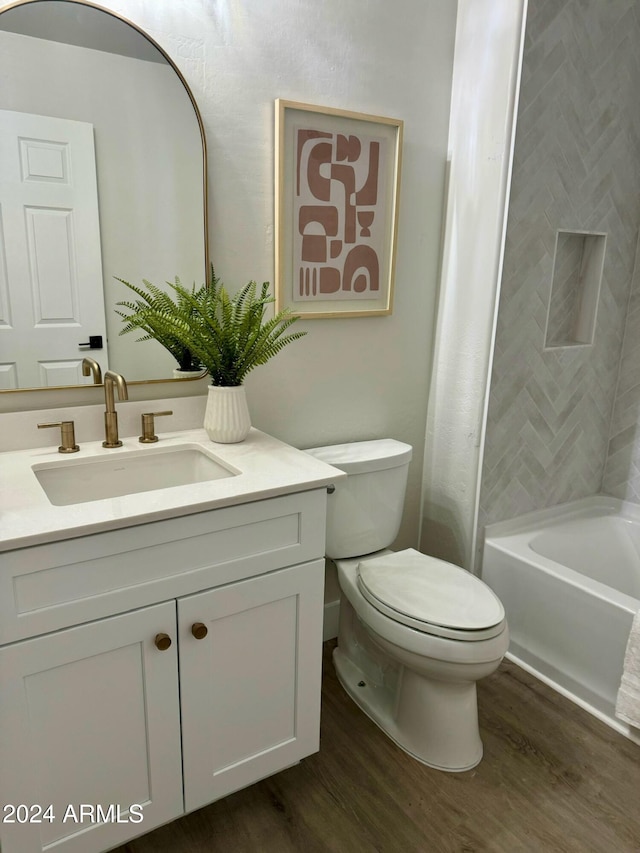 bathroom featuring hardwood / wood-style flooring, vanity, and toilet