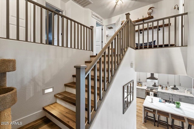 staircase featuring hardwood / wood-style floors