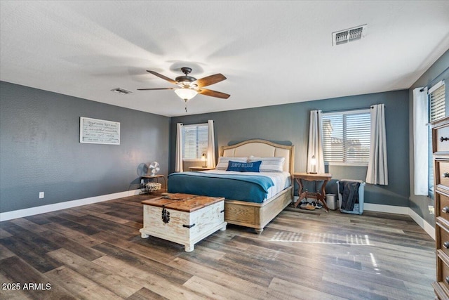 bedroom featuring wood-type flooring and ceiling fan