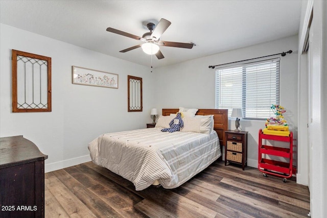 bedroom featuring dark hardwood / wood-style floors and ceiling fan