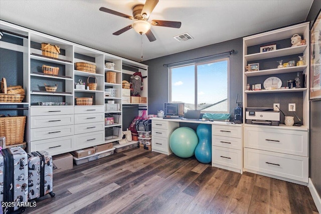 office with dark hardwood / wood-style floors and ceiling fan