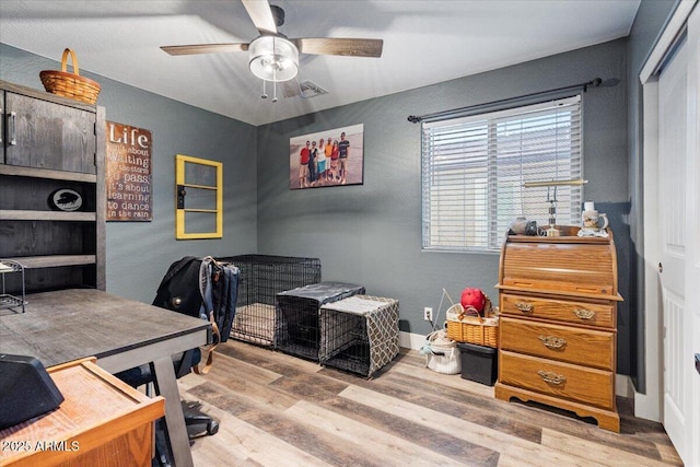 office area featuring ceiling fan and light hardwood / wood-style floors