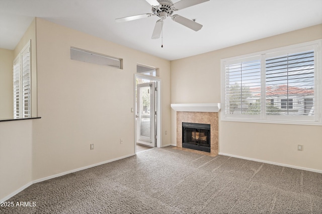 11375 E Sahuaro Dr Unit 2033, Scottsdale, AZ 85259 - unfurnished living room featuring carpet floors, a tiled fireplace, and a ceiling fan
