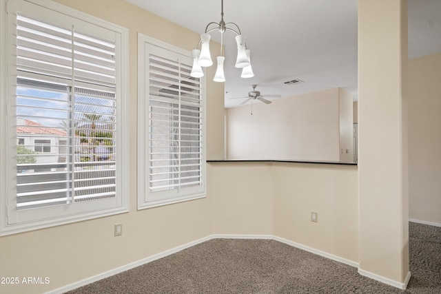 11375 E Sahuaro Dr Unit 2033, Scottsdale, AZ 85259 - unfurnished dining area featuring a chandelier, carpet floors, and a ceiling fan