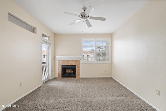 11375 E Sahuaro Dr Unit 2033, Scottsdale, AZ 85259 - unfurnished living room featuring plenty of natural light, a ceiling fan, a fireplace, and carpet