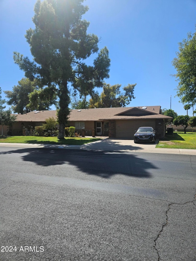 ranch-style house featuring a garage