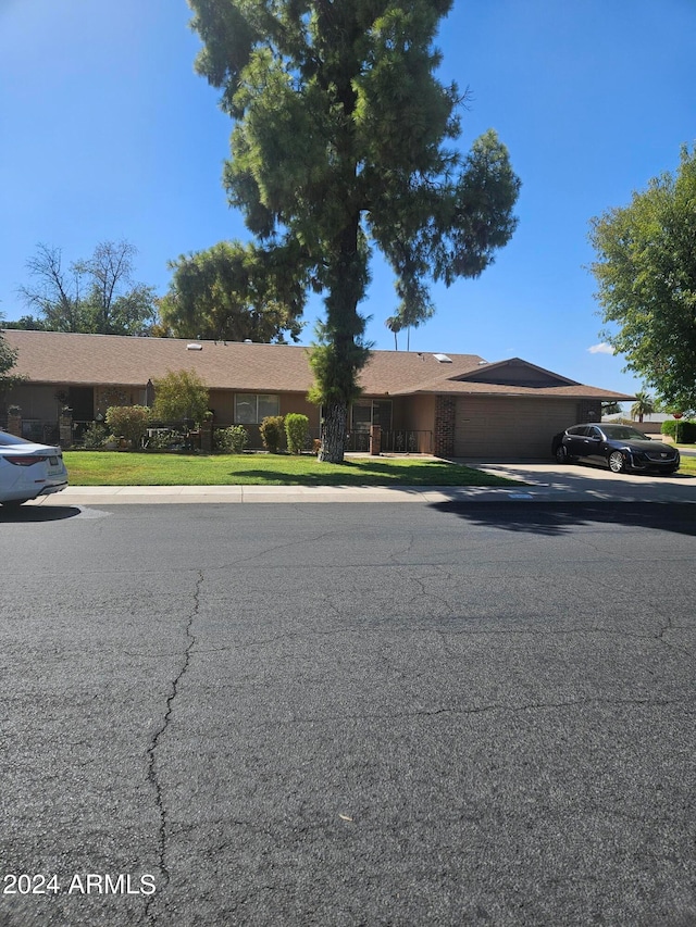 ranch-style house featuring a garage