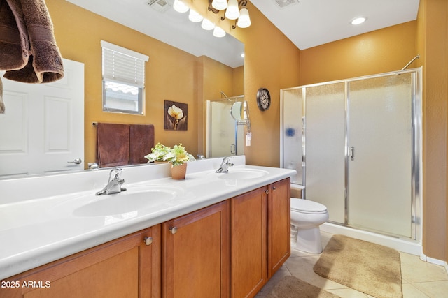 bathroom featuring a stall shower, visible vents, and a sink