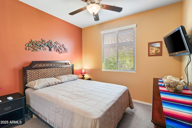 bedroom with carpet floors, ceiling fan, and baseboards